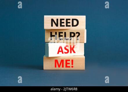 Support and need help ask me symbol. Concept words Need help ask me on wooden blocks on a beautiful grey table grey background. Business, support and Stock Photo