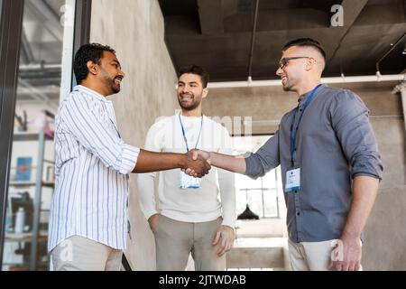 happy businessmen making handshake at office Stock Photo