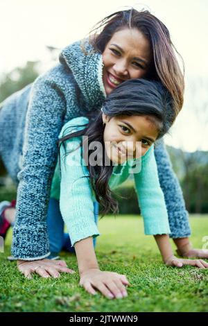 Everything a mother and daughter relationship should be. Portrait of a happy mother and daughter having fun outdoors. Stock Photo