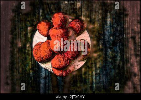 Original Black Forest Bollen hat in front of wooden wall in surrealistic style Stock Photo