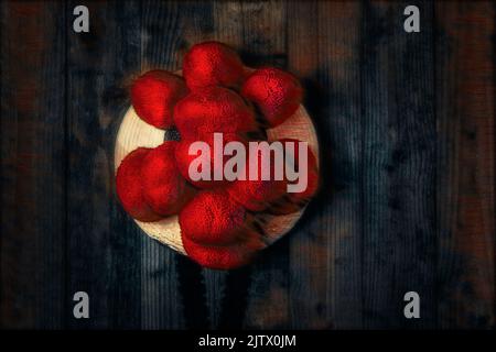 Original Black Forest Bollen hat in front of wooden wall in surrealistic style Stock Photo