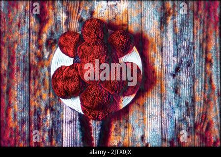 Original Black Forest Bollen hat in front of wooden wall in surrealistic style Stock Photo