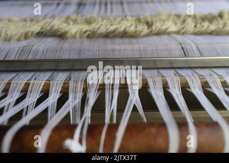 Handloom weaver weaves traditional Lungi, in Keraniganj, near Dhaka ...