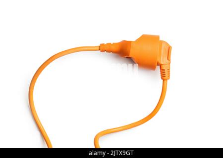Connected orange electric plug isolated on the white background. Stock Photo