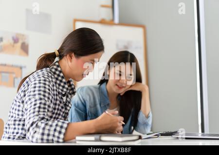 Construction business plan concept, Two architects discuss about project and blueprint of building. Stock Photo