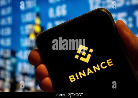 In this photo illustration, the cryptocurrency exchange trading platform Binance logo is displayed on a smartphone screen. (Photo by Budrul Chukrut / SOPA Images/Sipa USA) Stock Photo