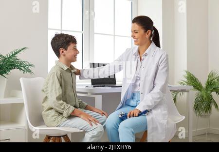 Teen boy at an appointment with a pediatrician in clinic, healtcare and medicine concept. Stock Photo
