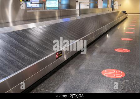 Empty baggage carousel in a terminal as a symbol of a lost suitcase Stock Photo