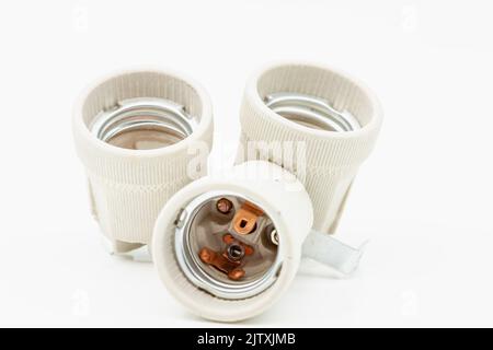 Electric ceramic socket model E27, for lighting. Selective focus with shallow depth of field. Stock Photo