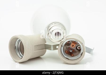 Electric ceramic socket model E27, for lighting. Selective focus with shallow depth of field. Stock Photo