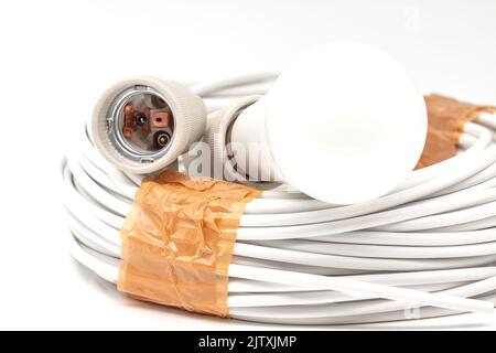 Electric ceramic socket model E27, for lighting. Selective focus with shallow depth of field. Stock Photo