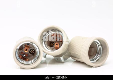 Electric ceramic socket model E27, for lighting. Selective focus with shallow depth of field. Stock Photo