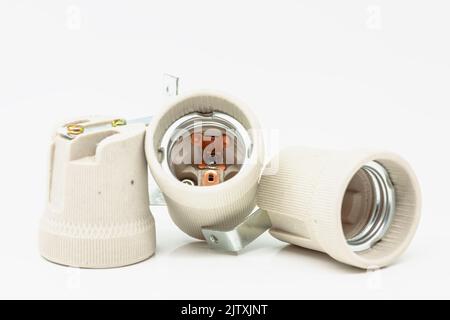 Electric ceramic socket model E27, for lighting. Selective focus with shallow depth of field. Stock Photo