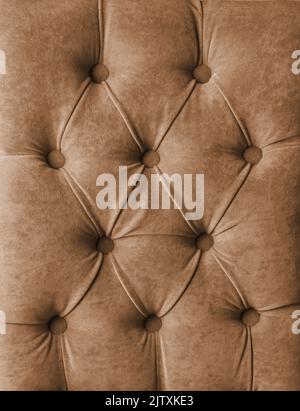 Brown capitone checkered soft fabric textile coach velours decoration with buttons Stock Photo