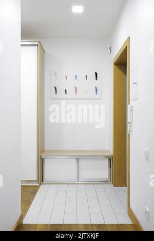 Hooks for clothes in the hallway interior of the apartment Stock Photo