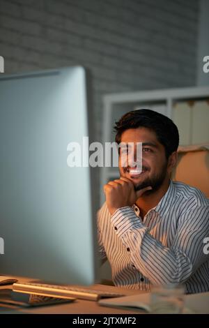 Young Indian business executive working in office Stock Photo