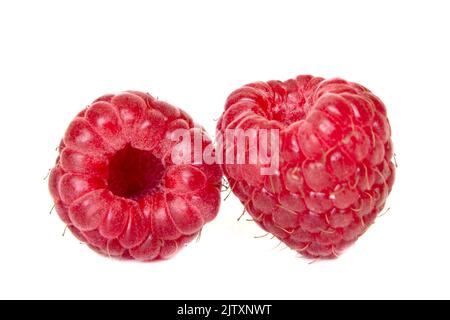 Isolated ripe berries. Two fresh raspberries isolated on white background Stock Photo