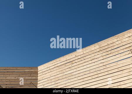 Abstract wooden architecture background, inner corner is under blue sky on a sunny day Stock Photo
