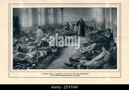A Russian Priest is conducting a service in a rude field hospital filled with Russian prisoners at Suwalki from the book The story of the great war; the complete historical records of events to date DIPLOMATIC AND STATE PAPERS by Reynolds, Francis Joseph, 1867-1937; Churchill, Allen Leon; Miller, Francis Trevelyan, 1877-1959; Wood, Leonard, 1860-1927; Knight, Austin Melvin, 1854-1927; Palmer, Frederick, 1873-1958; Simonds, Frank Herbert, 1878-; Ruhl, Arthur Brown, 1876-  Published 1920 Stock Photo