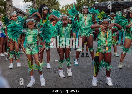 West Indian kids dancing at the Notting Hill carnival. Stock Photo