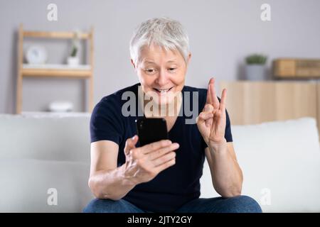Using Sign Language For Deaf Disability In Video Conference Stock Photo