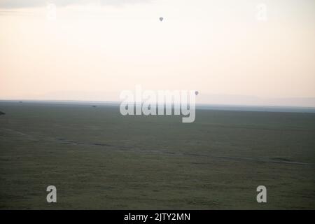 Two balloons over Masai Mara Kenya Stock Photo