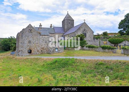 Penmon Priory on the Wales Cost Path, Penmon near Beaumaris, Isle of Anglesey, Ynys Mon, North Wales, UK. Stock Photo
