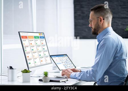 Kanban Project Management Software On Laptop. Digital Calendar Schedule Stock Photo