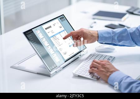 Digital Electronic Bill And Accountant E Invoice On Laptop Stock Photo