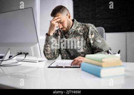 Sad Frustrated Military Veteran Student Doing Test In College Stock Photo