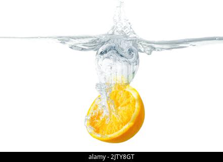 Orange half placed in water with splashes isolated on whited background Stock Photo