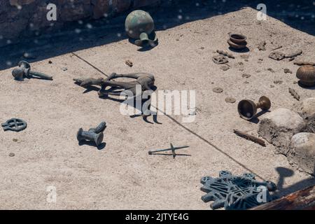 Inside view of the king's tomb containing various metal objects in Alacahoyuk archaeological site, Corum, Turkey Stock Photo