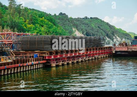 A grid of steel bars for building bridge. Bridge pile reinforcement structure Stock Photo