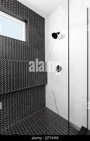 https://l450v.alamy.com/450v/2jtyhf6/a-luxurious-shower-with-a-black-herringbone-tiled-wall-a-large-window-and-black-shower-head-2jtyhf6.jpg