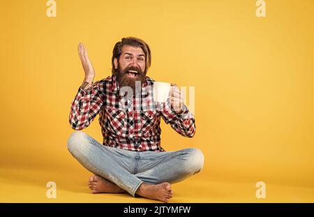 surprise. need some coffee for inspiration. perfect start of the day. happy bearded man drinking morning coffee. man drink hot tea from cup. good Stock Photo