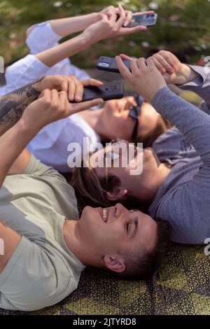 Group of young attractive smiling students dressed casual having fun on campus at the university Stock Photo