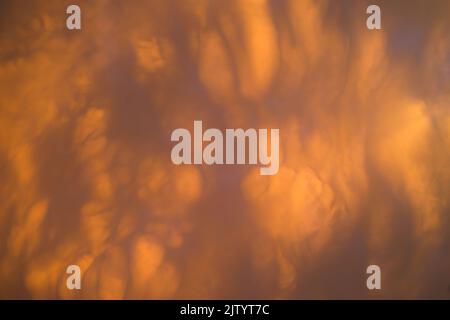 Cloudy sky on fire at sunset Stock Photo