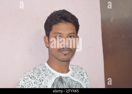 An indian man posing for photo at home. Stock Photo