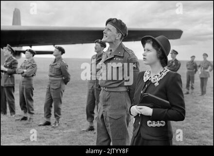 Princess Elizabeth WW2 Visiting Airborne Troops, May 1944 HRH Princess Elizabeth (Queen Elizabeth II) watching parachutists rehearsing parachute drops during a visit to airborne forces in England in the run-up preparations to D-Day. D-Day, Normandy Landings 1944, North West Europe, Second World War World War II Stock Photo