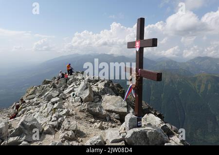 Cross at the summit of Krivan a mountain in the High Tatras of Slovakia, Europe Stock Photo