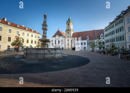 Main Square with Old Town Hall, Maximilian Fountain (or Roland’s Fountain) and Jesuit Church - Bratislava, Slovakia Stock Photo