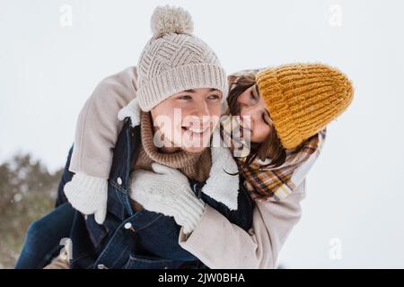happy couple having fun in winter park Stock Photo