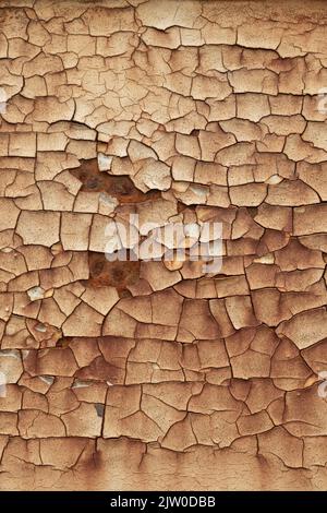 Chipped flaking paint on brown metal background Stock Photo