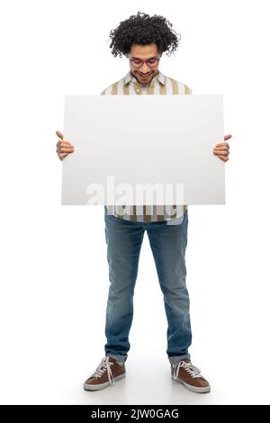 smiling man in glasses holding big white board Stock Photo