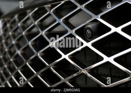 Car front view camera for parking assistance. The concept of safe car driving while parking. Stock Photo