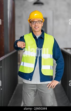 male architect in helmet and safety west at office Stock Photo