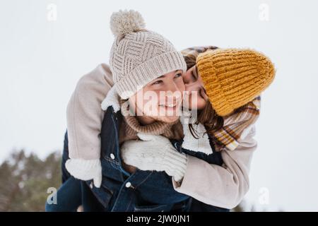 happy couple having fun in winter park Stock Photo