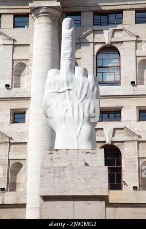 L.O.V.E. Sculpture by Maurizio Cattelan in front of the Milan stock exchange, Milan, Italy Stock Photo