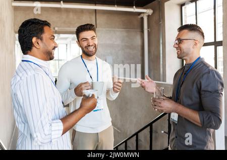 businessmen drinking coffee and water at office Stock Photo