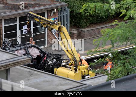 A range rover crashed into a tesla in a tesla test centre near Park Royal underground station. The debris of the range rover remains on the tracks of Stock Photo